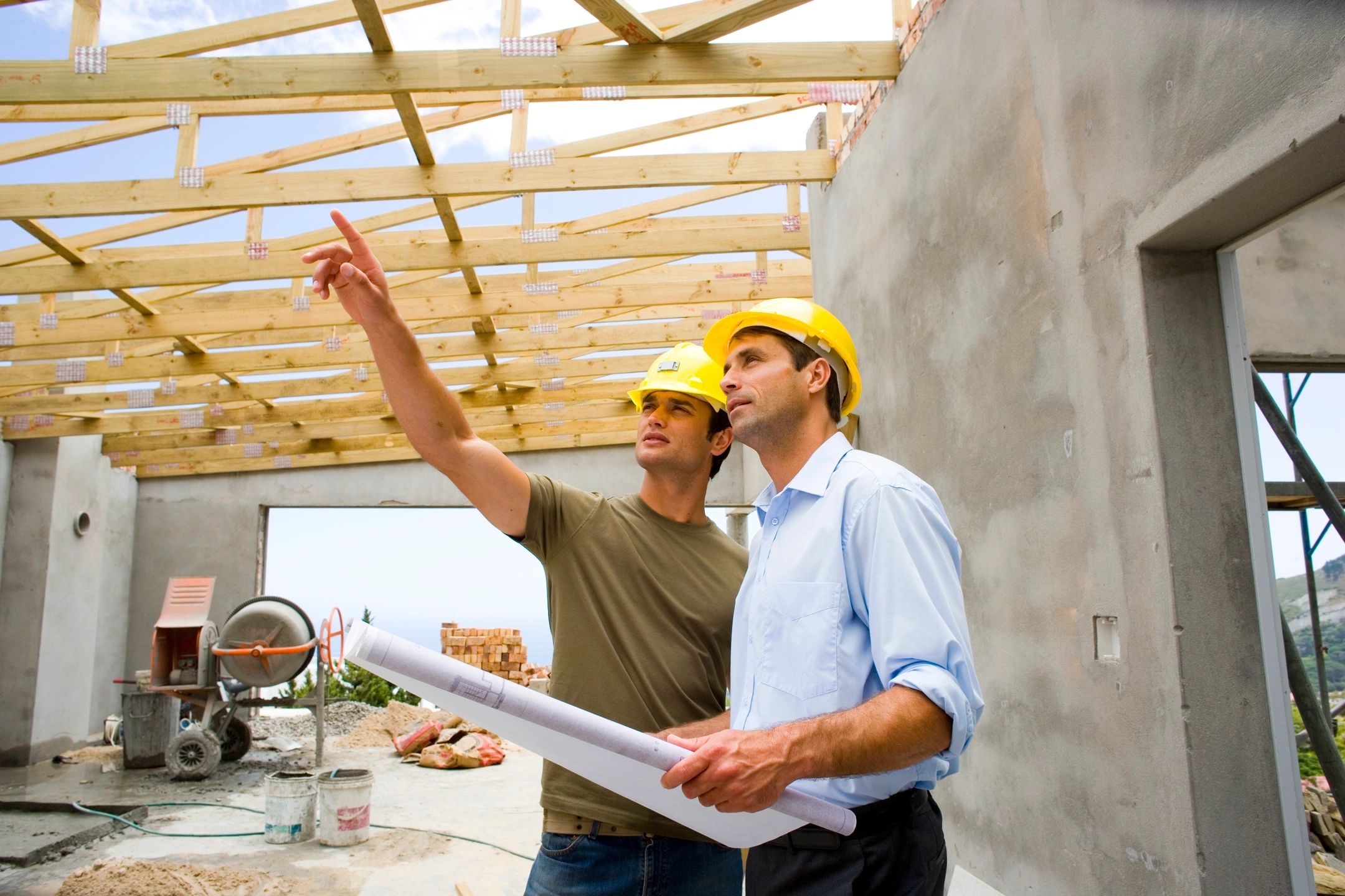 Two people wearing hard hats